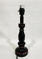 Full view of black lamp base with socket