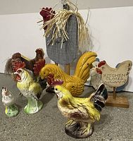 Front view of all eight rooster and chicken decor items
