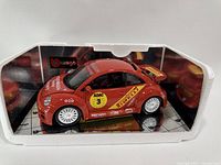 Front left side view of the die-cast Beetle in foam packaging