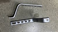 Both galvanized steel brackets showing hole pattern and L-shape