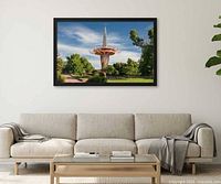 Framed color photograph of Prayer Tower hung above sofa