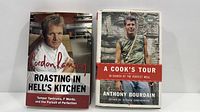 Front covers of both hardcover books standing upright