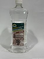 Front view of sealed Escort Premium Lamp Oil bottle