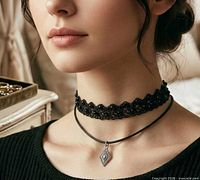 model wearing both chokers layered