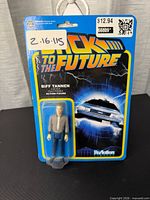 Front view of sealed Biff Tannen ReAction figure on card