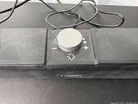Front view of ELEGIANT sound bar showing grill and volume knob