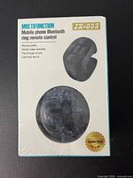 Front of sealed box showing product name, image of ring remote, feature list
