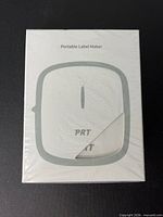 Front of sealed box showing Portable Label Maker graphic and PRT branding