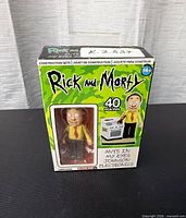 Front of sealed Rick and Morty construction set box showing figure window and 40-piece count