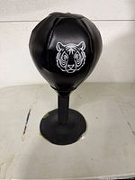 Black speed punching ball on suction base with tiger graphic