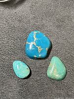 Three turquoise cabochons group shot