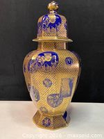 Front view showing cobalt blue and gold honeycomb pattern with cartouches