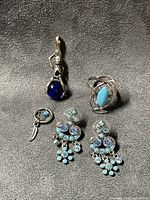 Group shot showing all five costume jewelry pieces