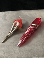 Top view of both glass ornaments showing shapes and hooks