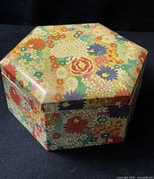 Closed hexagonal trinket box showing floral pattern