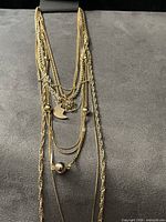 Front view of layered chains and pendants