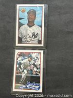 Front view of both sleeved cards showing player images and set design
