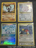 Front view of all four sleeved cards