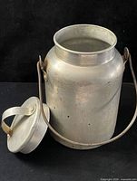 Jug with lid removed showing interior and bail handle