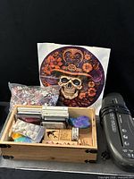 All items grouped: box with stamps and ink pads, sealed puzzle pieces, poster, Battery Guard