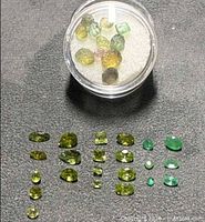 All 33 stones laid out with container