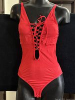 front view showing lace-up plunge design and overall shape