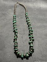 Full view of turquoise and sterling silver bead necklace