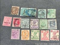 Overall view of all stamps laid out on fabric background