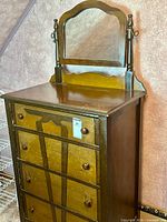 Full view of dresser showing mirror, drawers, casters