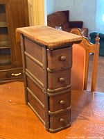 Full view of four-drawer wood sewing cabinet