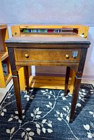 Closed wooden stowaway sewing table