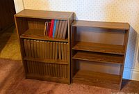 Front view of both bookcases filled with books