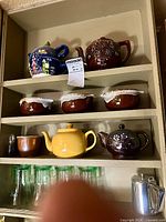 Full view of cupboard shelves showing all listed items
