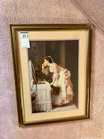 Full view of framed print hung on wall