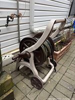 Full view of hose reel cart with hose