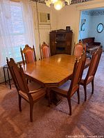 Entire dining set showing table and six chairs