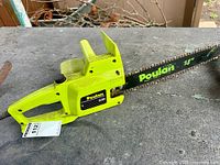 Left side view showing Poulan 1420 model label, housing, and bar