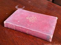 Front perspective of red cloth hardcover book