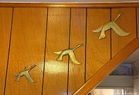 Three plaques mounted on wall