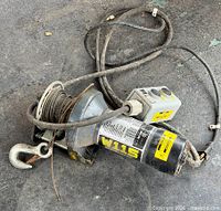 Overall view of Superwinch W115 winch, cable and hook visible