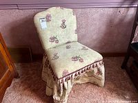 Full view of upholstered floral slipper chair