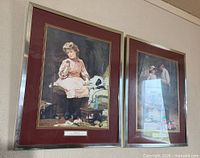 Both framed prints on wall