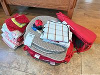 Group shot of chair cushions, towels, scrubbies and accessories