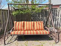 Front view showing entire swing and cushions