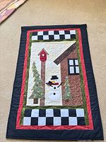 Full view of quilted wall hanging front showing design and borders