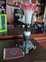 Full view of lamp and coaster on table