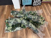 Pile of sealed artificial ivy garlands