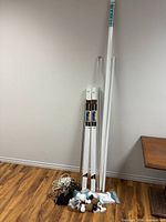 Group shot of all rods leaning against wall with accessories on floor