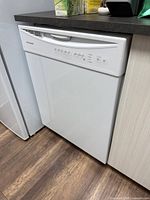 Front view of Frigidaire built-in dishwasher showing entire appliance in cabinetry