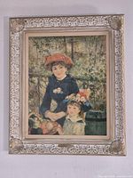 Full view of framed Renoir lithograph on wall